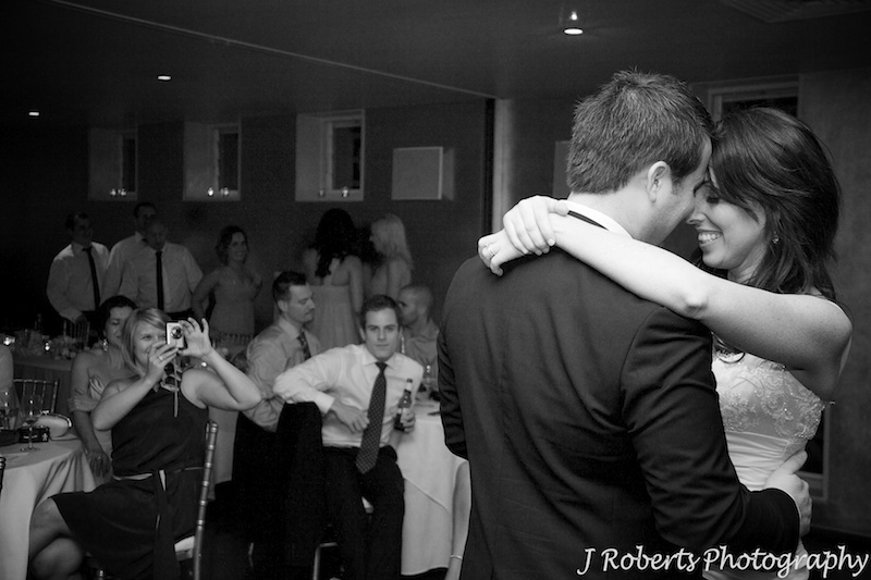 Couple embracing during the bridal waltz - wedding photography sydney